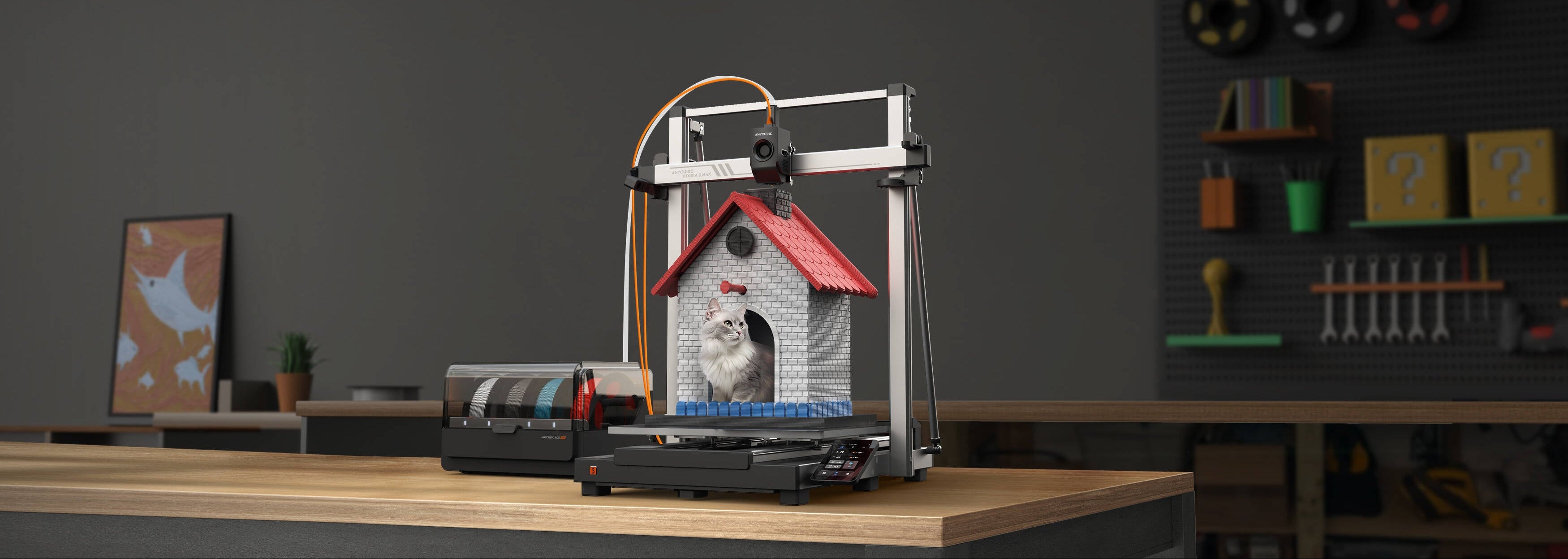 3D printer in a workshop setting with a small house model on a table.